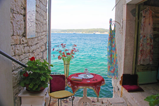 Fototapeta ROVINJ, ISTRIA PENINSULA, CROATIA, 30 June 2013: Beautiful romantic old town of Rovinj. View of charming narrow stone Streets with colorful shops.