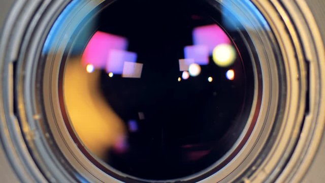 A video camera lens opens up during zoom. 