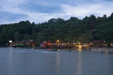 Fototapeta na wymiar Colorful light of restaurants on the beach in Sihanoukville. Cambodia