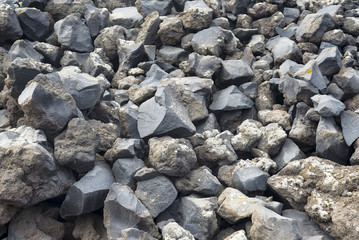 The texture of the volcanic stone from the island of Santorini.