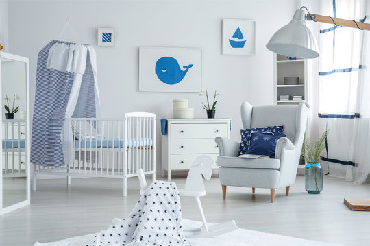 Armchair in bright baby's bedroom