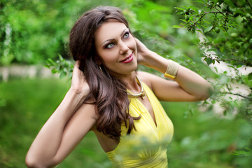 Wonderful girl in yellow dress, closeup. Creative portrait of girl