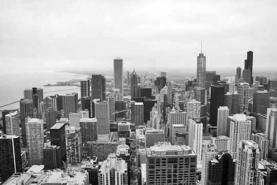 Urban city architecture background.Chicago skyline aerial view.An overhead view of the city of Chicago downtown taken from the John Hancock Center skyscraper.Horizontal composition in black and white.