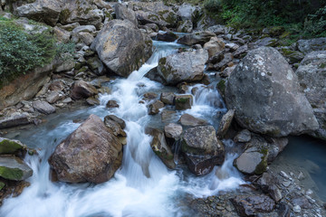 Mountain river and stones landscape natural environment. Hiking in the alps. Grawa Waterfall in Stubai Valley, Tyrol, Austria