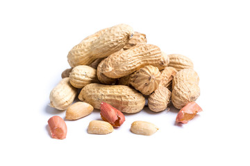 Pile of peanuts with nutshells on white background