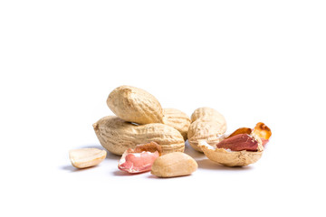 Pile of peanuts with nutshells on white background