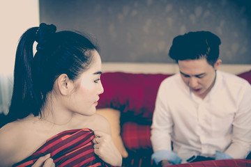 Sad Beautiful asian woman on the bed,after sex with boyfriend