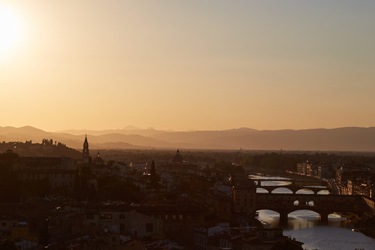 The urban landscape of Florence at sunset with a beautiful tonal perspective. View from above.