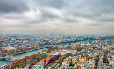 Paris aerial skyline with Seine river on a cloudy winter day, Fr