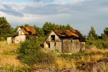 Abandoned houses in the Baltic Sea. Shore, nature and ruins facilities architecture concept. Mohni, small island in Estonia, Europe.