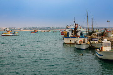 Fototapeta na wymiar Fishing boats in the port of Sagres in the southwest cape of Europe.