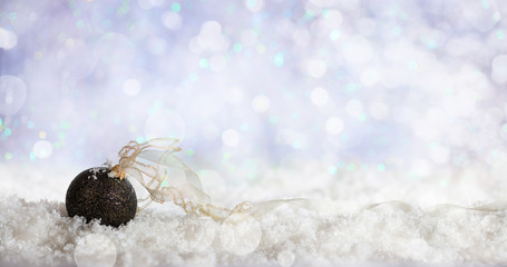Christmas ball on Christmas snowy bokeh background