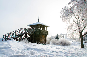 A watchtower wooden tower in winter, when there is a lot of snow. Poltava, Ukraine