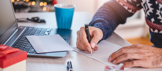 Men writing greeting cards