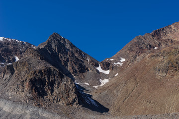 Mountains and peaks landscape. Stubaier Gletscher covered with glaciers and snow, natural environment. Hiking in the Stubai Alps. Ski resort in Tirol, Austria, Europe