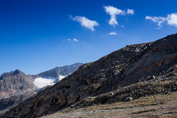 Mountains and peaks landscape. Stubaier Gletscher covered with glaciers and snow, natural environment. Hiking in the Stubai Alps. Ski resort in Tirol, Austria, Europe