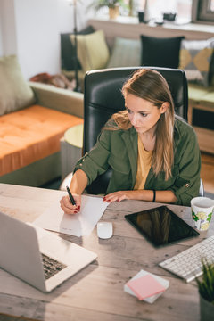 Young woman working at home