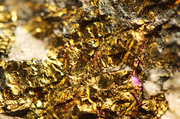 Golden background. Macro photo of the precious stone