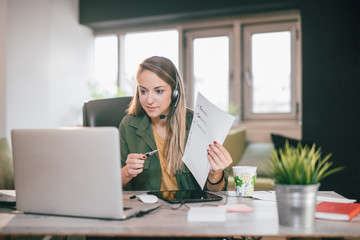 Young English teacher giving online lessons