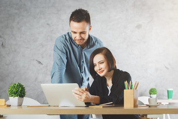 Caucasian businessman and woman working on project