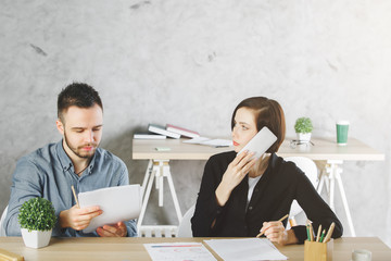 People on the phone doing paperwork