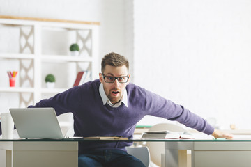 Shocked businessman working on project