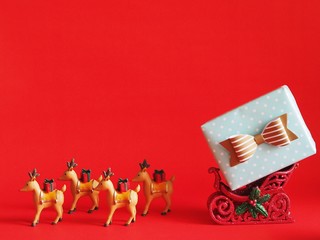 Gift box with Christmas ball decoration on red background,Christmas background concept.