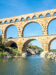 Fototapeta na wymiar Touists at Pont du Gard in Nimes, France