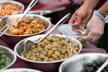 Bowl of fresh olives on a market food stall