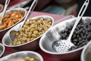 Bowl of fresh olives on a market food stall