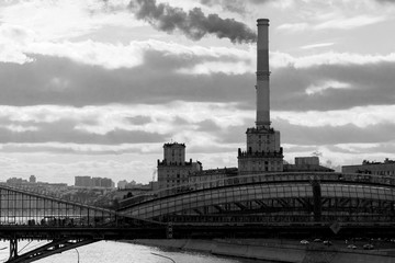 Obraz premium View on Moscow river. Rostovskay embankment. Bridge, factory. Black and white photo.