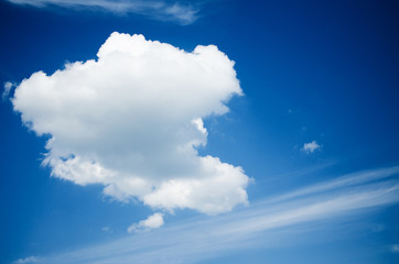 Naklejka na ściany i meble furry clouds on a blue sky on a beautiful summer