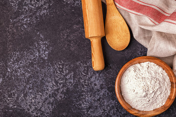 Ingredients for baking  - flour, wooden spoon, rolling pin, eggs