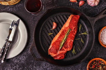 Beef steak on a dark background.