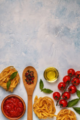 Italian food background with pasta, spices and vegetables.