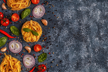 Italian food background with pasta, spices and vegetables.