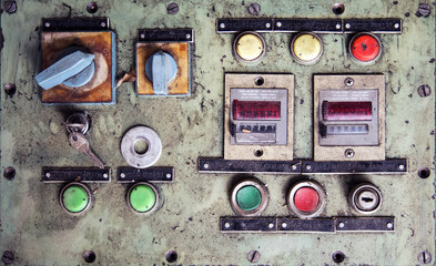 Dirty old machine control panel with buttons