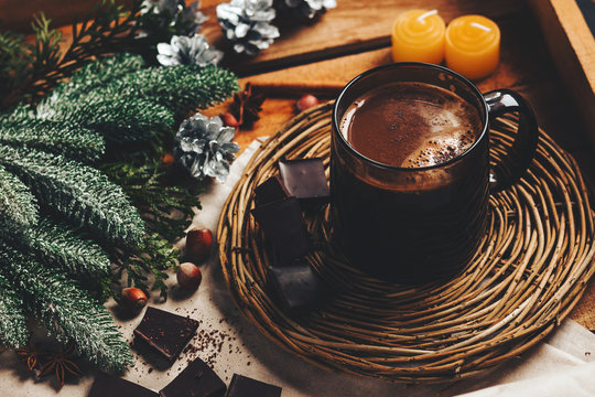 hot chocolate on a stand and a wooden background