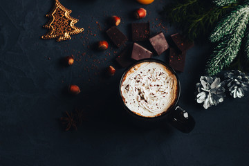 hot chocolate in a Christmas atmosphere, dark mug with whipped cream