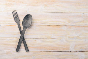 Old cutlery. On a wooden background. Top view. Free space for text.