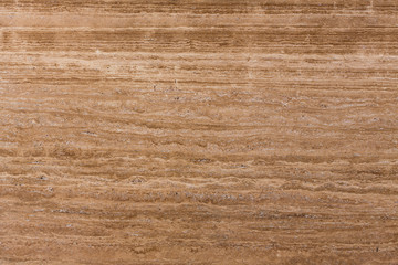 Travertine gold. Pattern of natural origin on the surface of the stone, close-up.