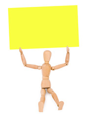 wooden man holds a note paper