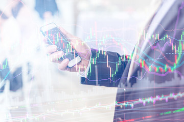 business financail ideas concept with businessman and stock market graph analysis