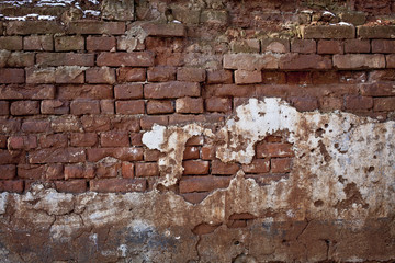 Old red damaged brick wall texture background