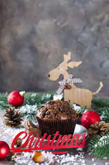 Chocolate muffin and Christmas inscription.