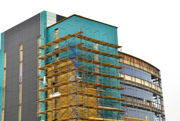 Multi-story steel and concrete commercial building under construction.