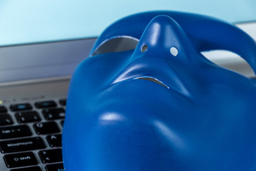 Identity on Social Networks concept. Blue mask on computer keyboard