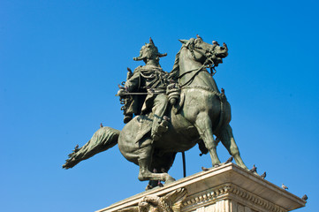 Fototapeta na wymiar Statue of Vittorio Emanuele II in milan with blue sky