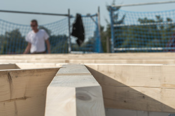 Roofers make the roof of a house in traditional construction