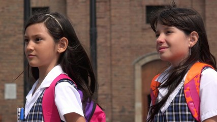 Female Students Staring Wearing School Uniforms